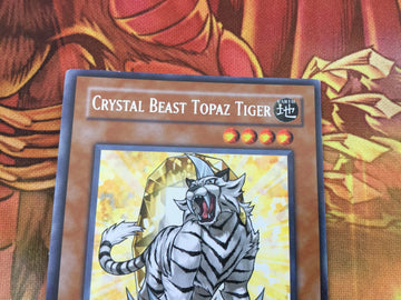FOTB-EN004 Crystal Beast Topaz Tiger Unlimited Edition Rare Yugioh Card (back)