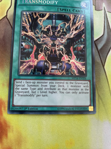 MP14-EN106 Transmodify 1st Edition YuGiOh Card Secret Rare LP (back)
