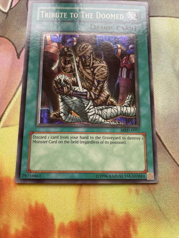MRD-E057 Tribute To The Doomed - Unlimited - Super - Yugioh (back)