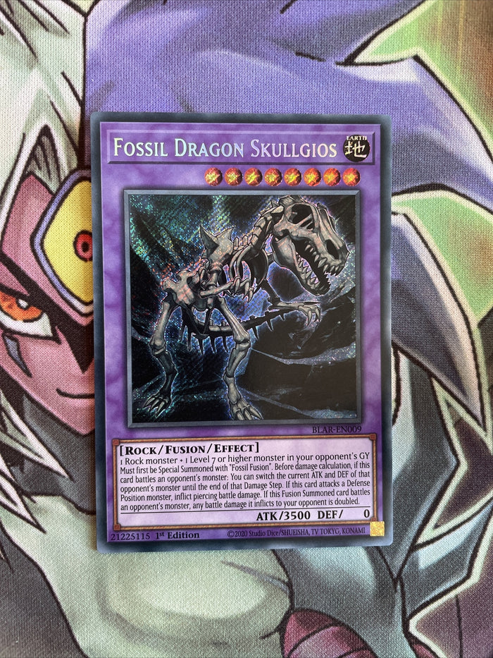 BLAR-EN009 Fossil Dragon Skullgios Secret Rare 1st Edition NM Yugioh Card