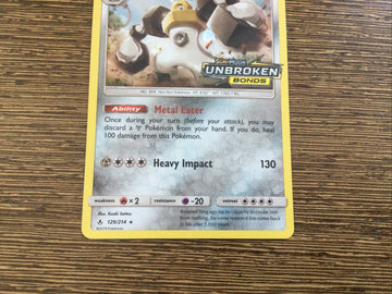 Pokemon Card MELMETAL 129/214 Unbroken Bonds Logo Stamped Promo (back)