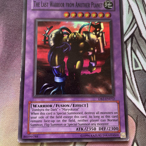 DB2-EN012 YUGIOH THE LAST WARRIOR FROM ANOTHER PLANET SUPER RARE LP