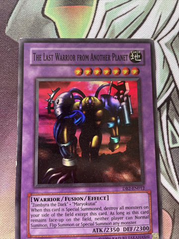 DB2-EN012 YUGIOH THE LAST WARRIOR FROM ANOTHER PLANET SUPER RARE LP (back)