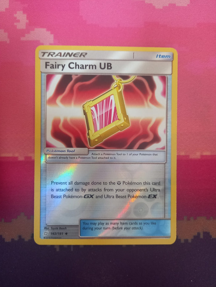 Pokemon card Fairy Charm UB 142 /181 Reverse Holo Team Up Near Mint