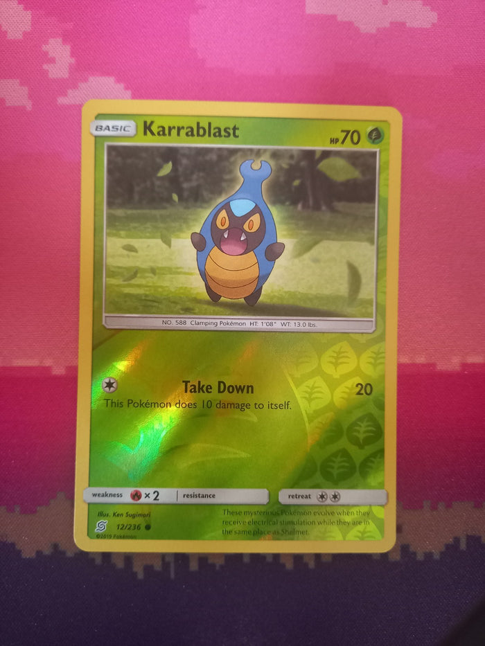Pokemon card Karrablast 12/236 Reverse Holo Unified Minds Near Mint