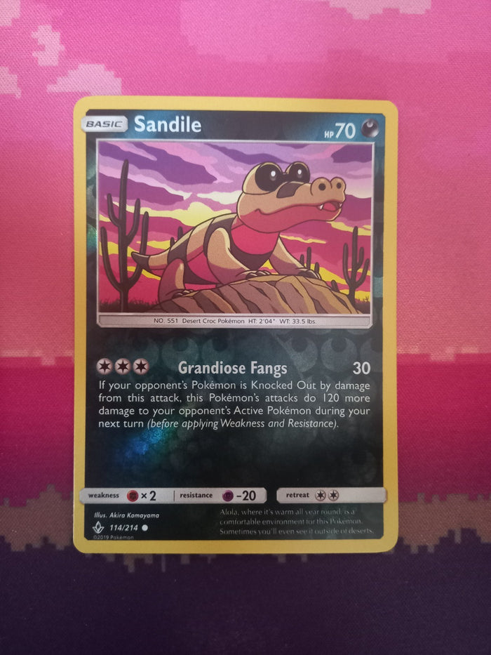 Pokemon card Sandile 114/214 Reverse Holo Unbroken Bonds Near Mint