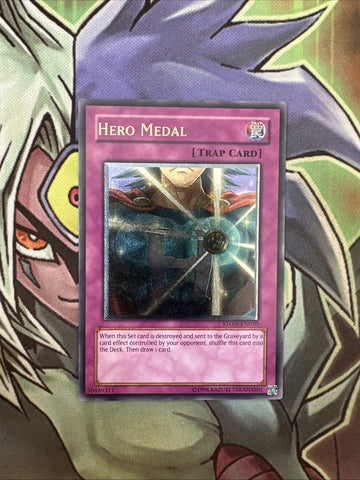 STON-EN050 Hero Medal Ultimate Rare Unlimited Edition NM Yugioh Card