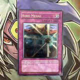 STON-EN050 Hero Medal Ultimate Rare Unlimited Edition NM Yugioh Card