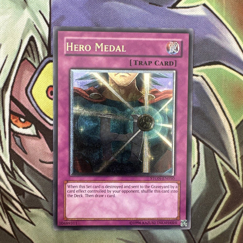STON-EN050 Hero Medal Ultimate Rare Unlimited Edition NM Yugioh Card
