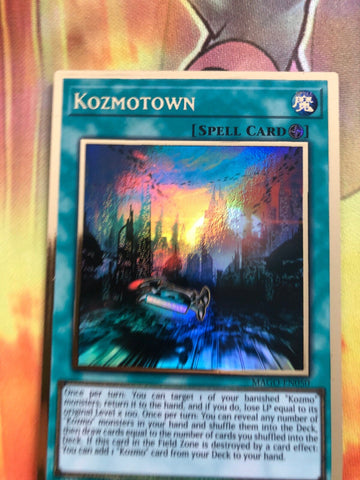 MAGO-EN050 Kozmotown Premium Gold Rare 1st Edition Mint YuGiOh Card (back)